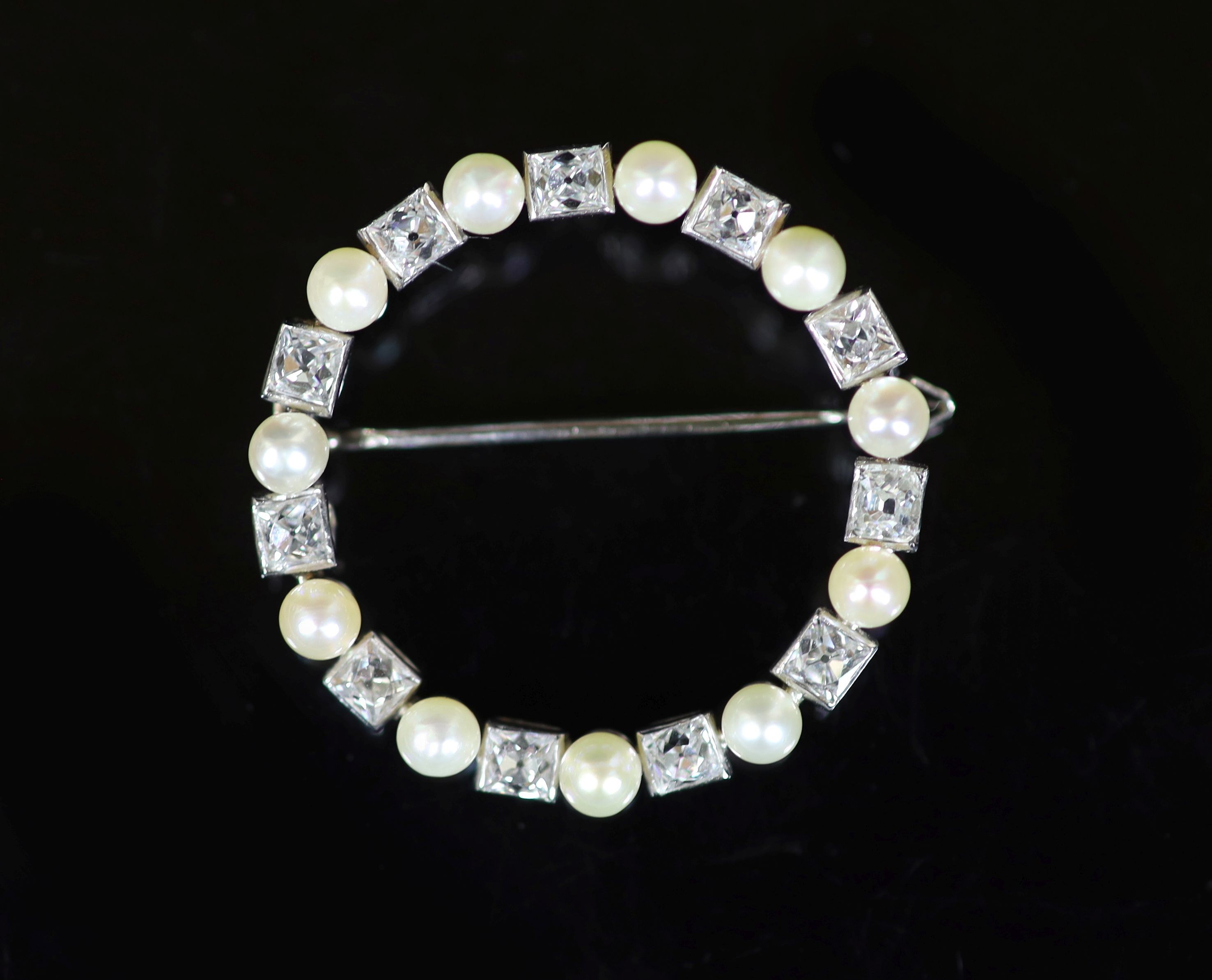 A mid 20th century French Cartier 18ct gold, pearl and diamond set open work circular brooch